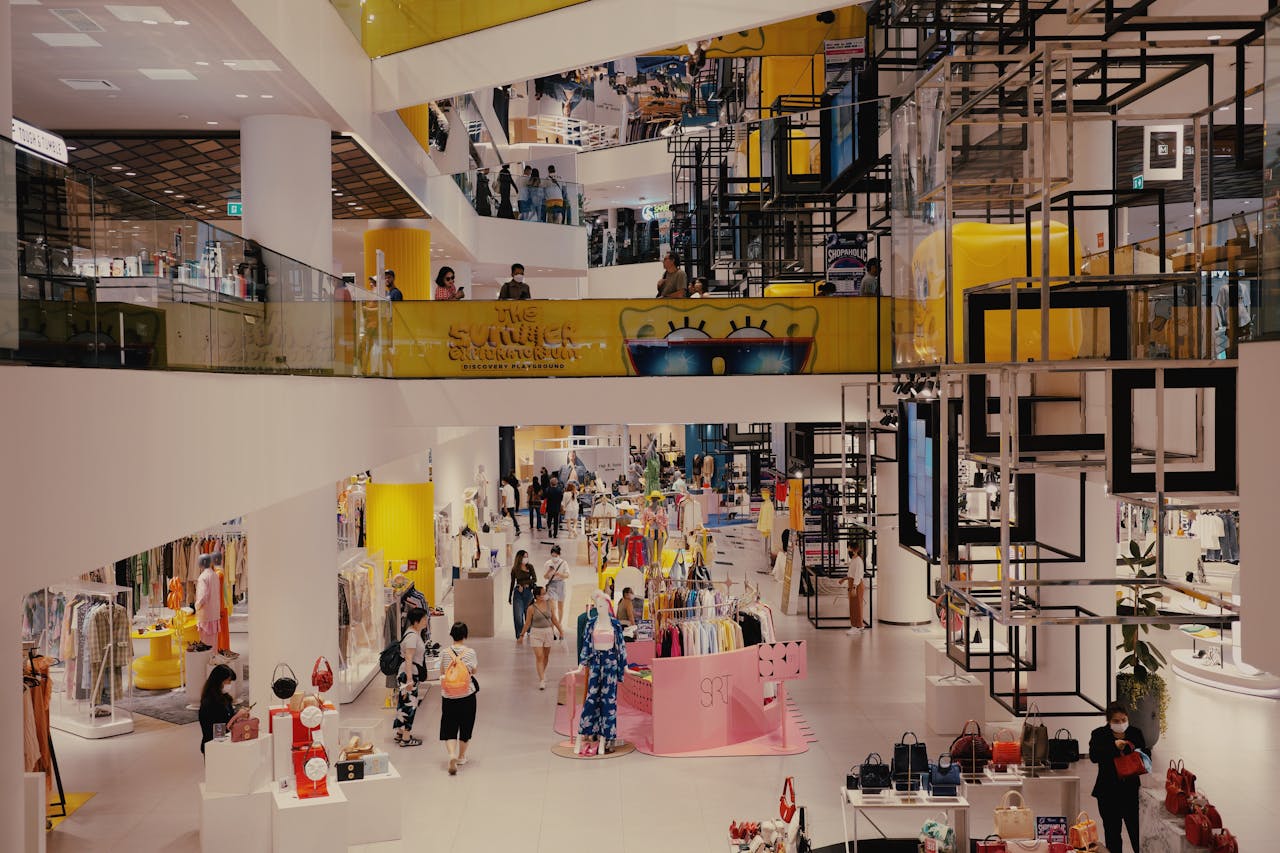about-img Vibrant mall filled with shoppers, contemporary decor, and stylish fashion outlets.
